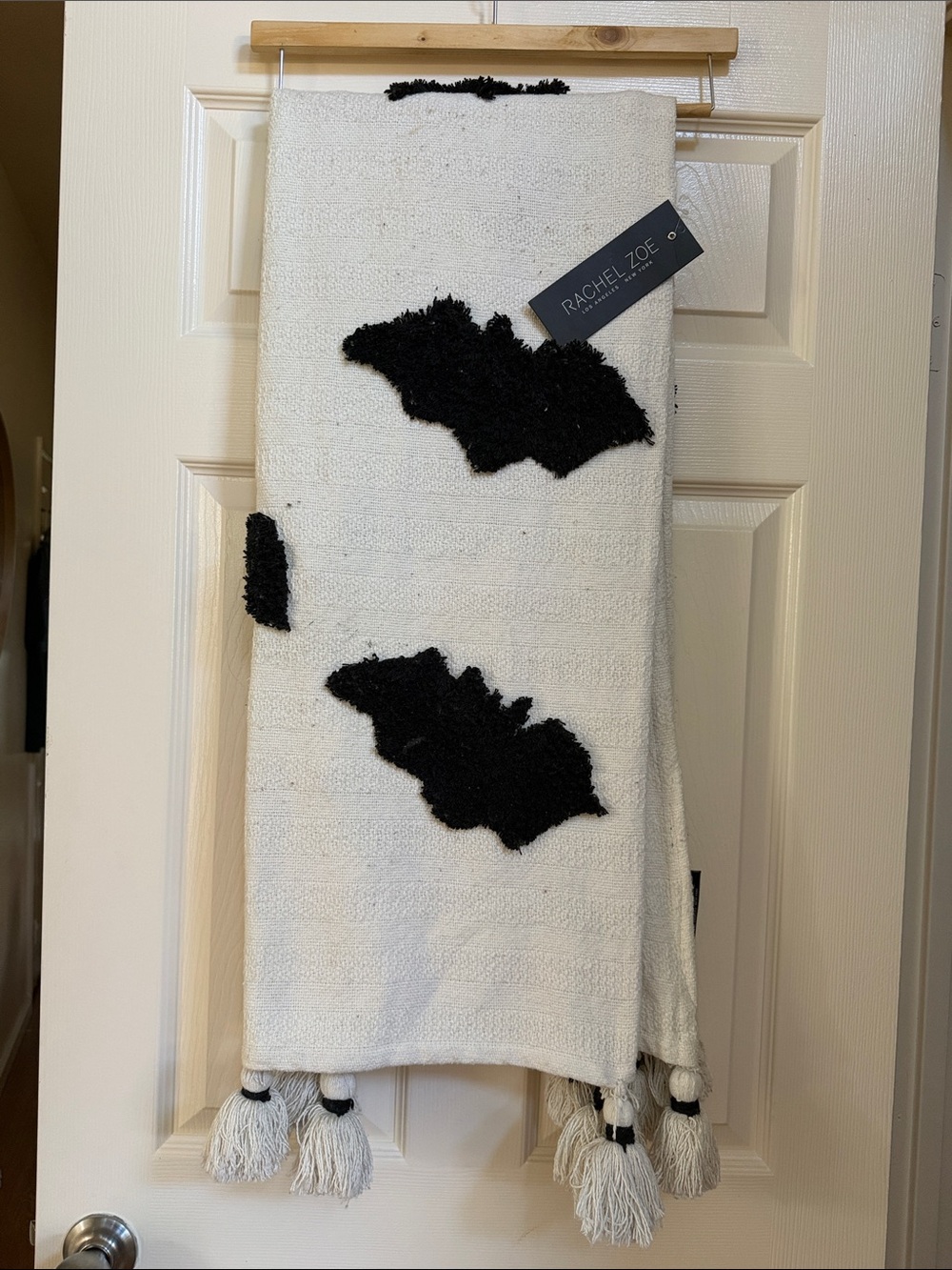 Rachel Zoe White decorative throw with Black Tufted Motifs and Tassel Accents
